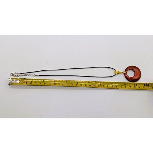 Red Circular Pendant Necklace With Gold Bail On Black Cord - Picture 4 of 5